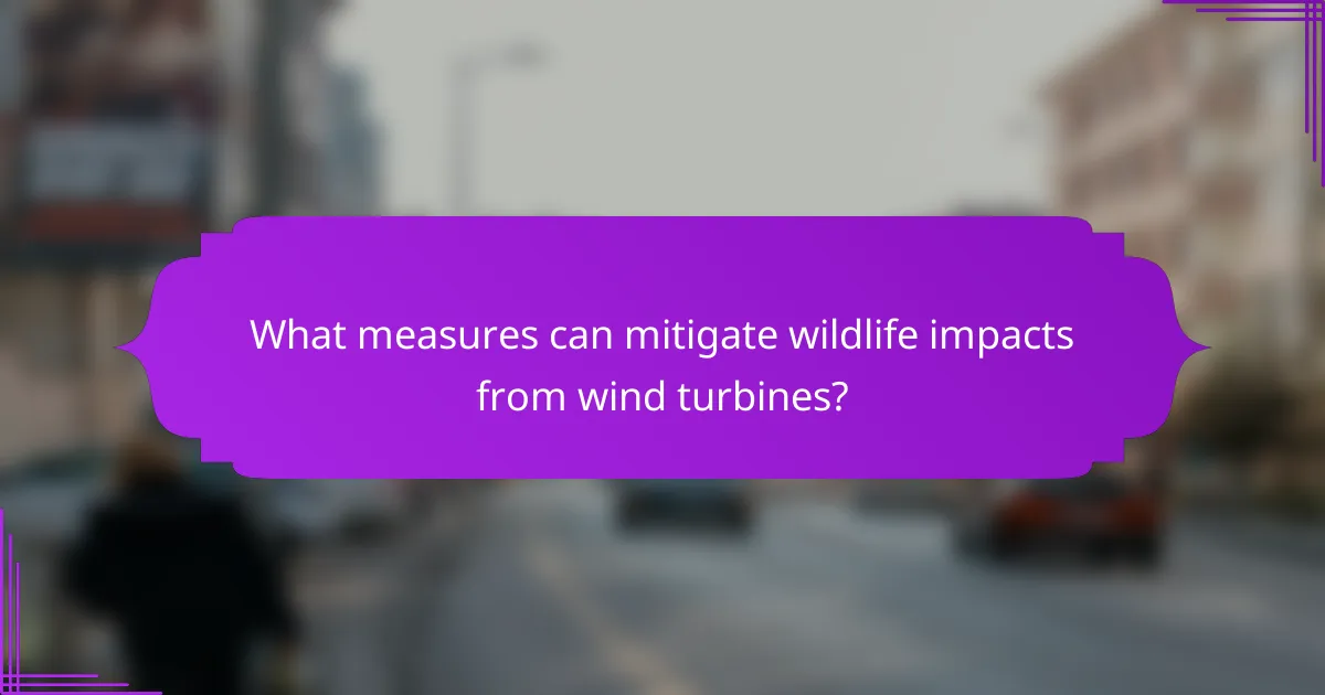 What measures can mitigate wildlife impacts from wind turbines?